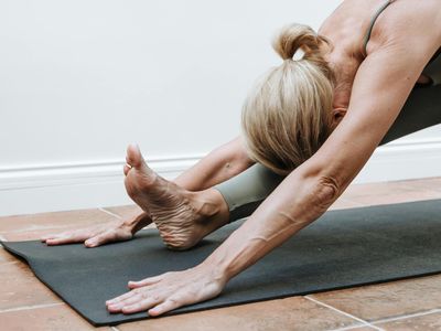 Zen-like balance of stones next to a workout mat.